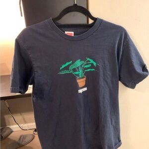 Supreme Navy Blue T-Shirt with Green Plant Design